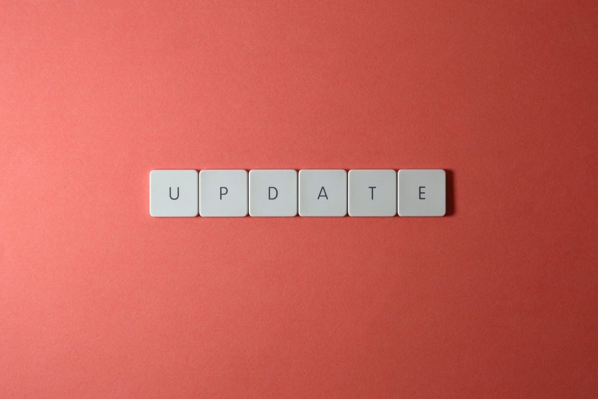 Keyboard keys spelling the word update on a red background