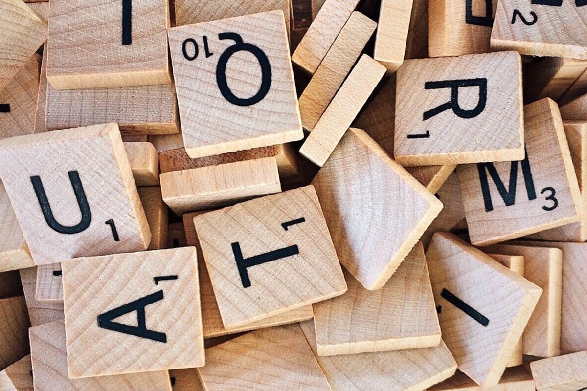 Wooden letter tiles scattered on a table
