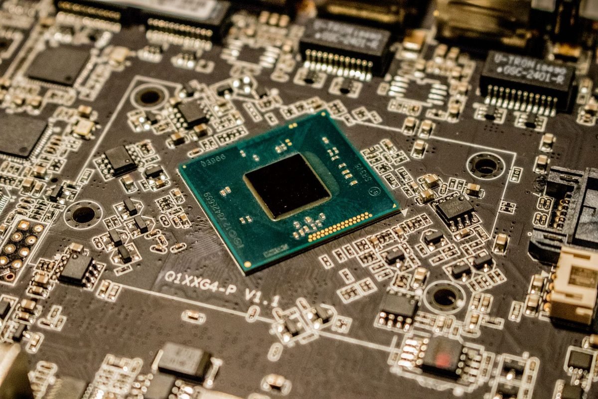 Computer chip mounted on a circuit board surrounded by small components