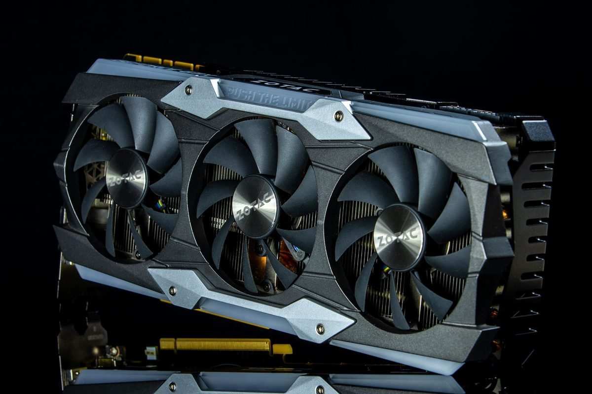 Graphics card with three cooling fans photographed against a black background