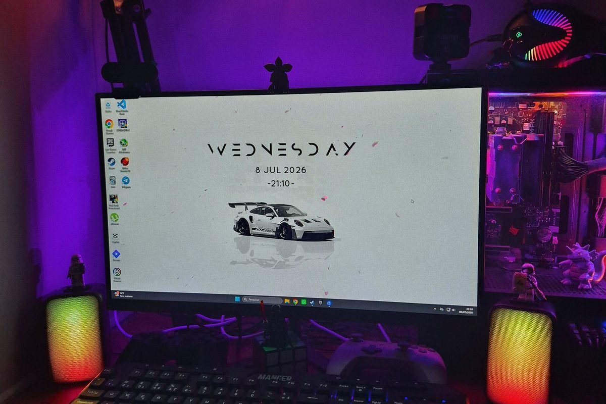 Gaming desk with a monitor, RGB lighting and a desktop computer