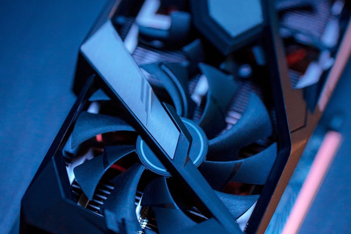 Close-up of a graphics card with cooling fans lit in blue