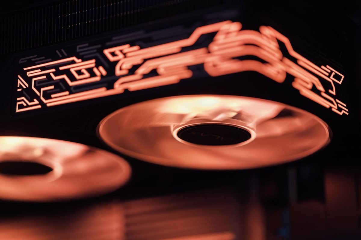 Glowing red computer cooling fans on a dark background