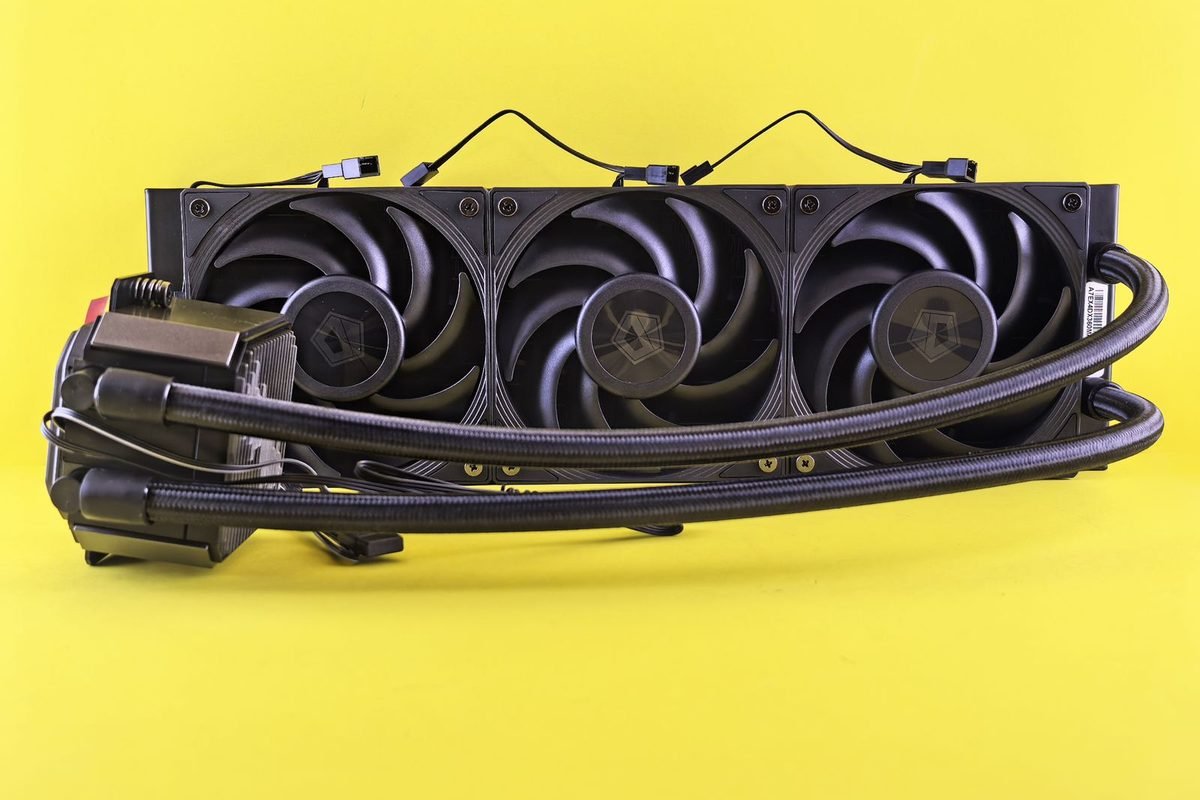 Triple-fan liquid cooler radiator on a yellow background