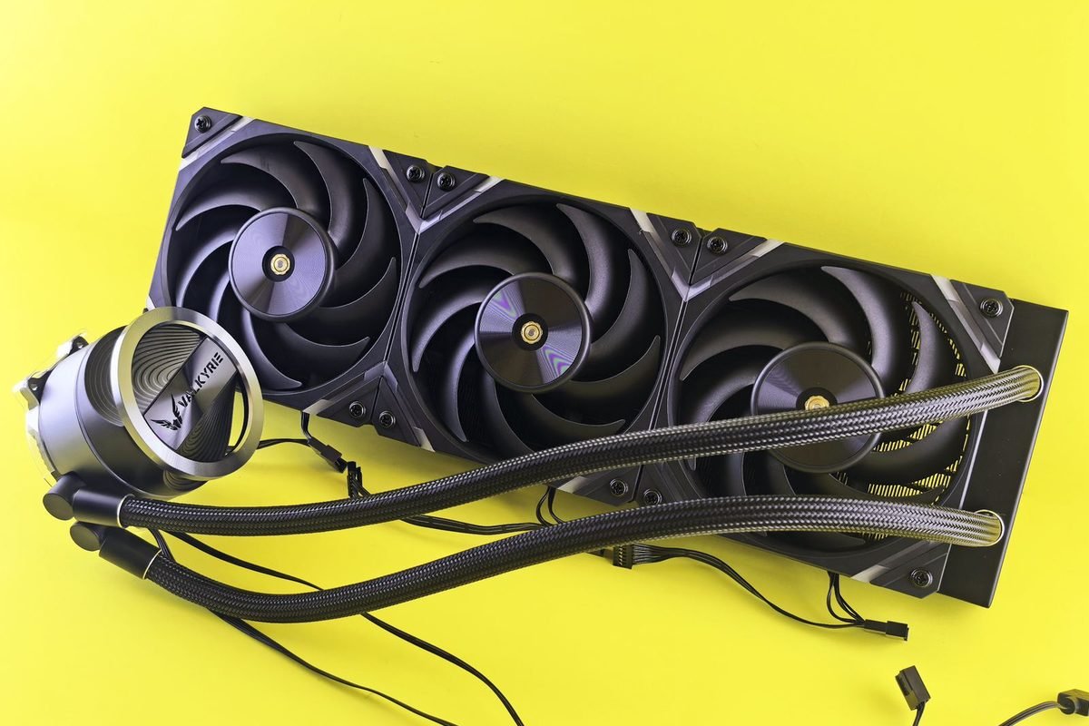 Triple-fan liquid cooler radiator on a yellow background