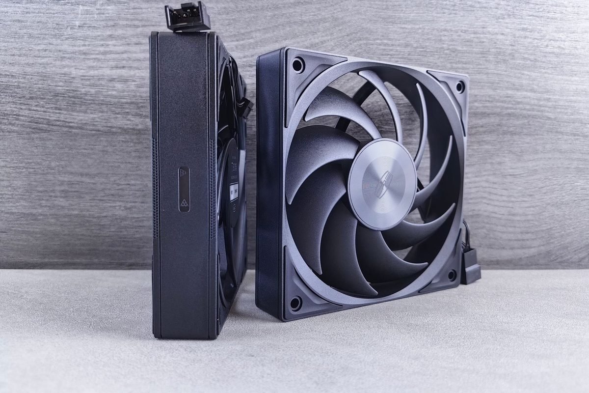 Two black computer cooling fans on a grey background